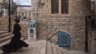 5 woman walks the street of Safed