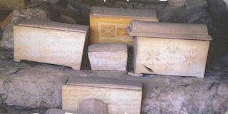 4 Ossuaries left in a cave.